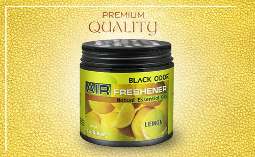 Air freshener with lemon scent on a yellow textured background