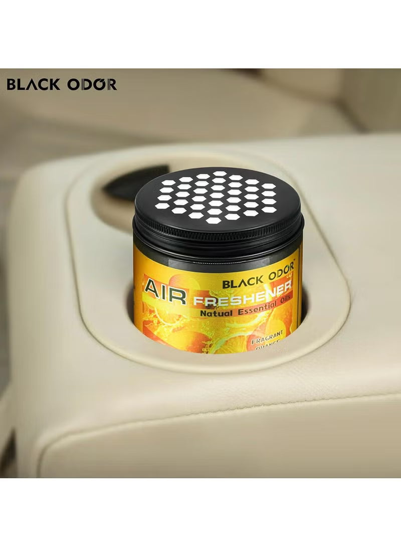 Car air freshener with black odor label in a car's air vent.