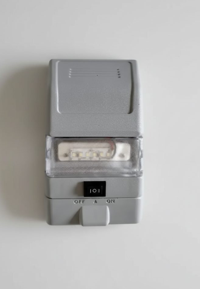 Gray electronic device with LED lights on a textured white surface