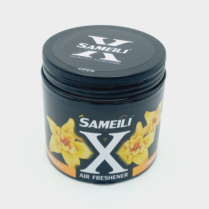 Sameili X air freshener container with black lid and yellow floral design on a white background