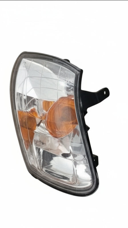 Pair of car headlight corner lamps with a label on a white background