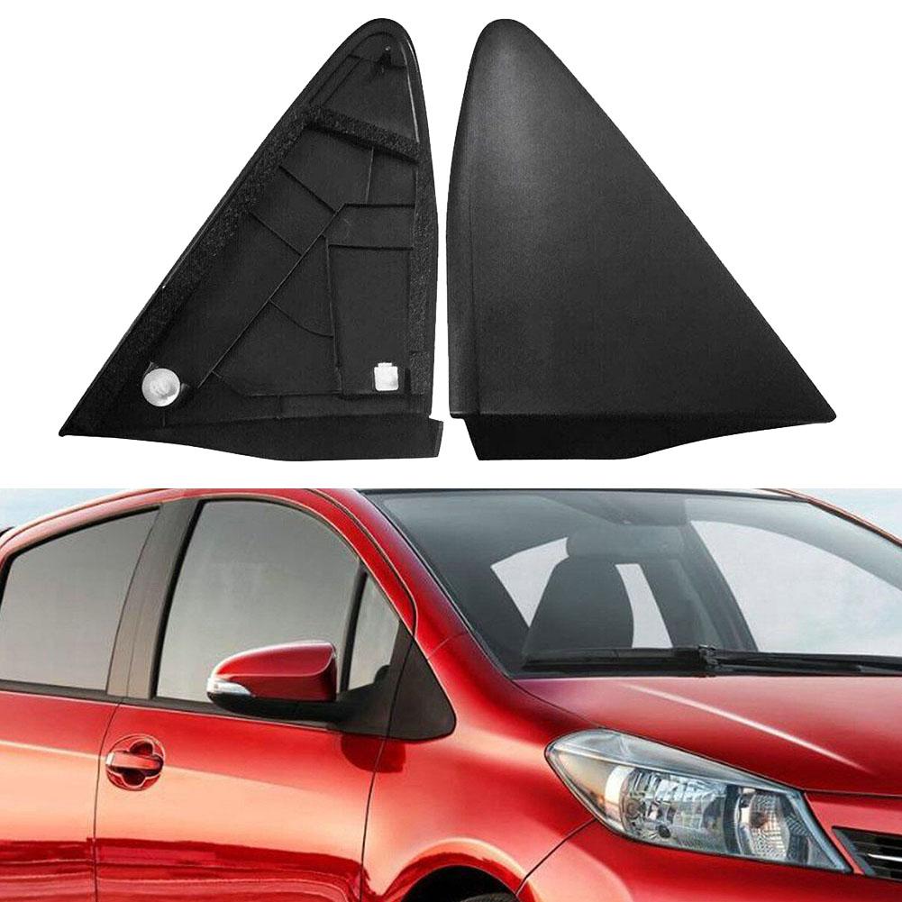 Two black car mirrors on a white background with a red car below.