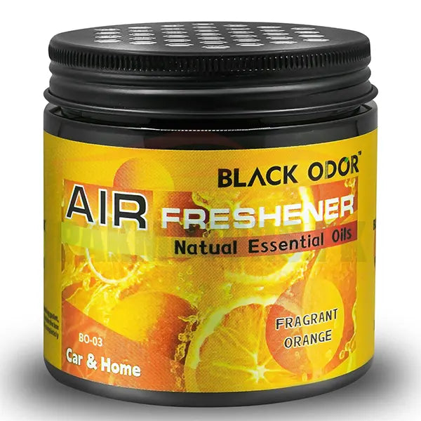 Black Odor air freshener jar with orange slices on a yellow background