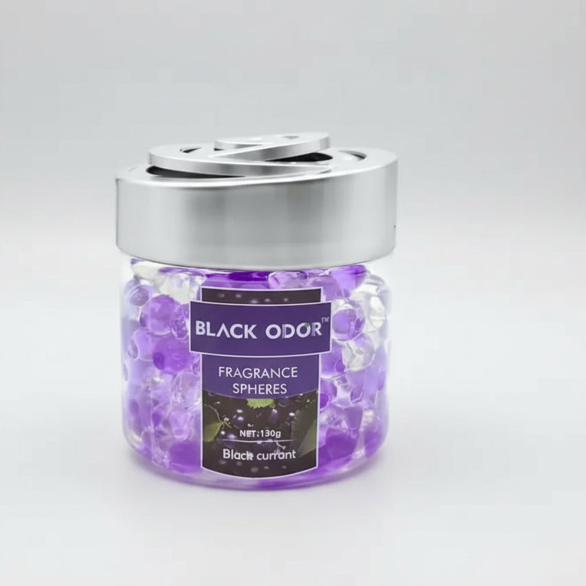 Jar of Black Odor fragrance spheres with a silver lid on a white background