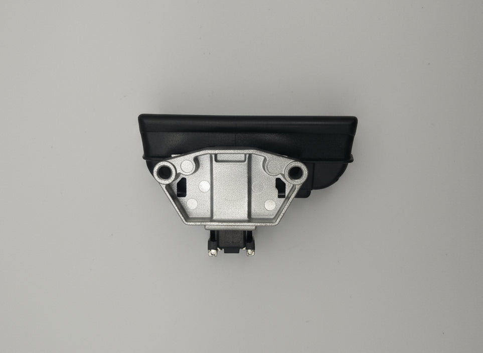 Metallic switch or relay on a wooden surface