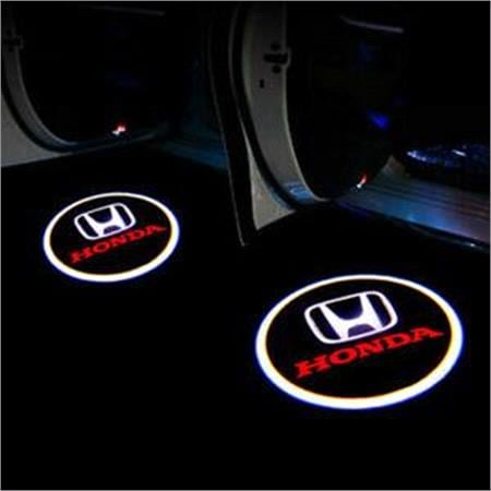 Honda logo coasters on a car's interior surface