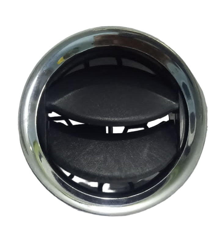 Car air vent with silver rim and black interior on a textured gray background