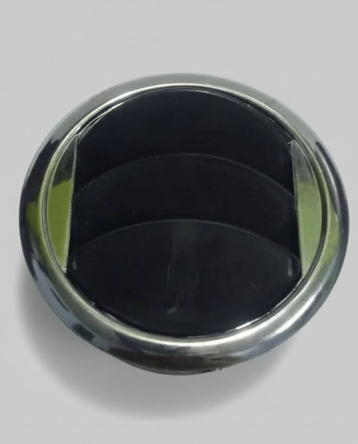 Metallic circular object on a light-colored surface