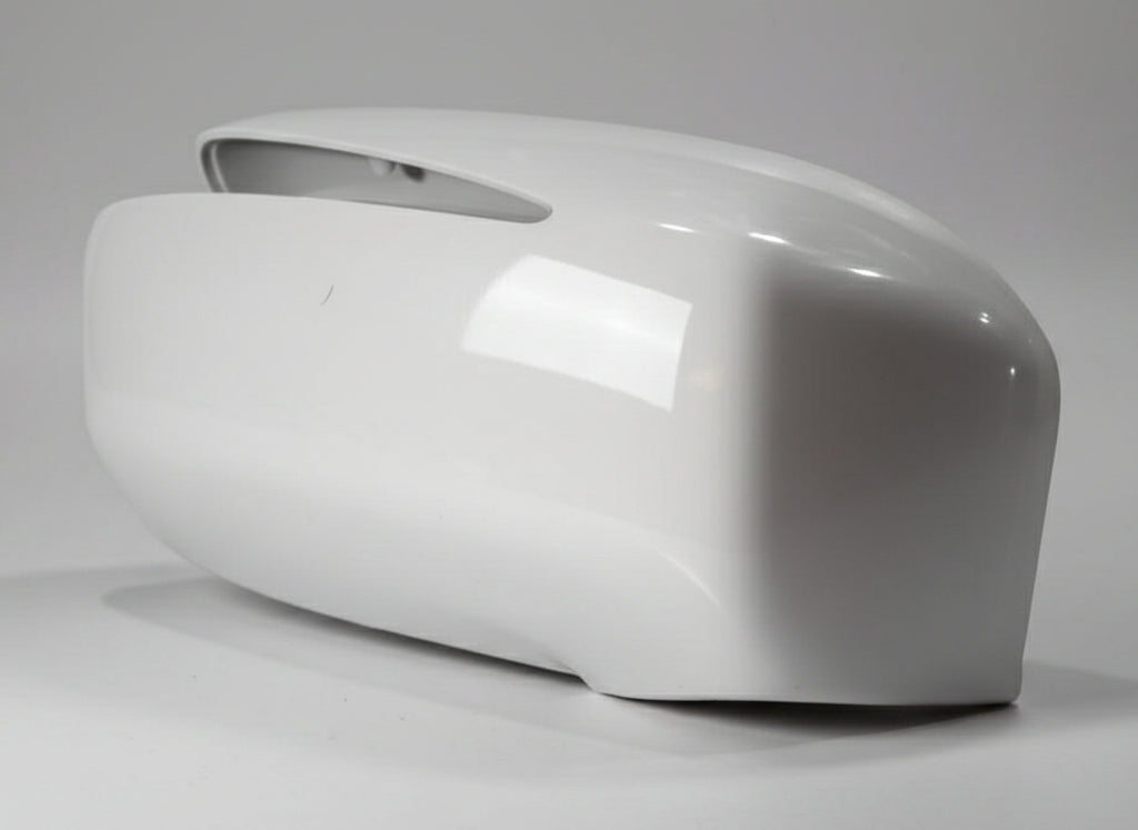 White plastic part on a textured gray surface