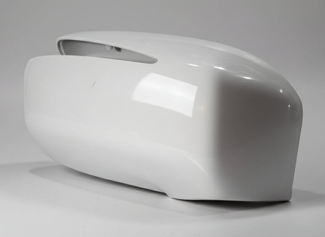 White plastic part on a textured gray surface