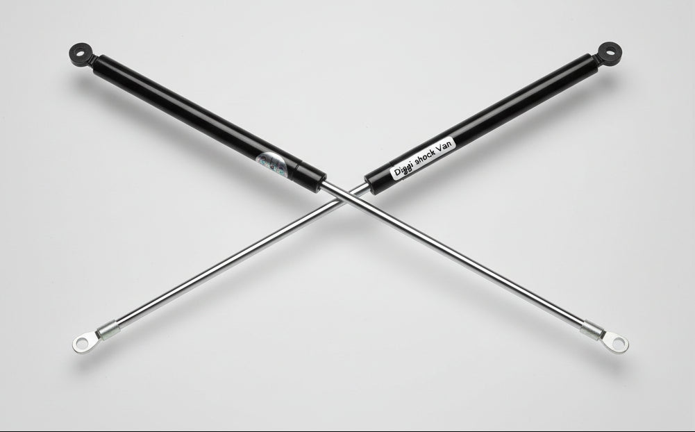 Metal rod on a table with 'Diggi shock Van' text overlay