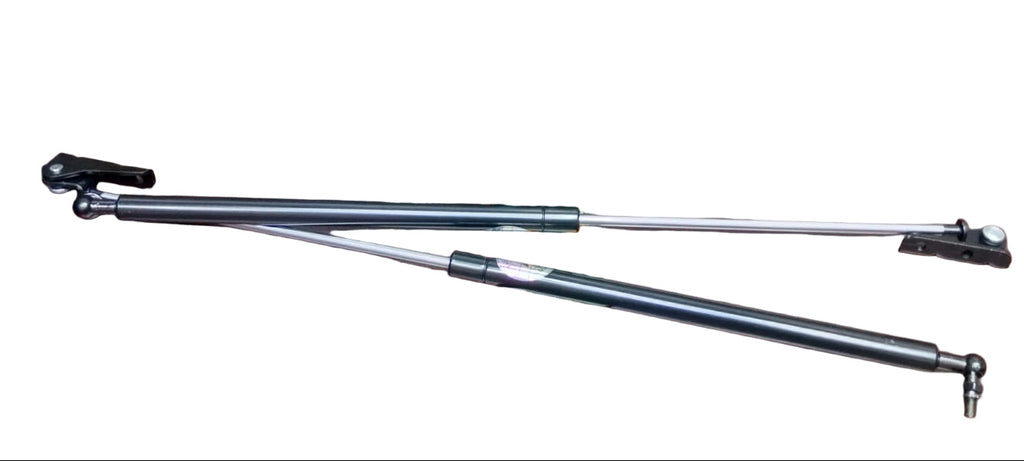 Two metal shock absorbers on a wooden table with 'Diggi shock Cultus' text above.