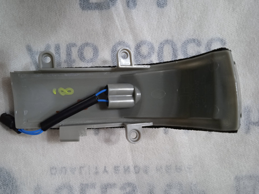 Mechanical component on a gray background with text