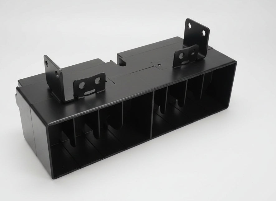 Black metal bracket on a white surface