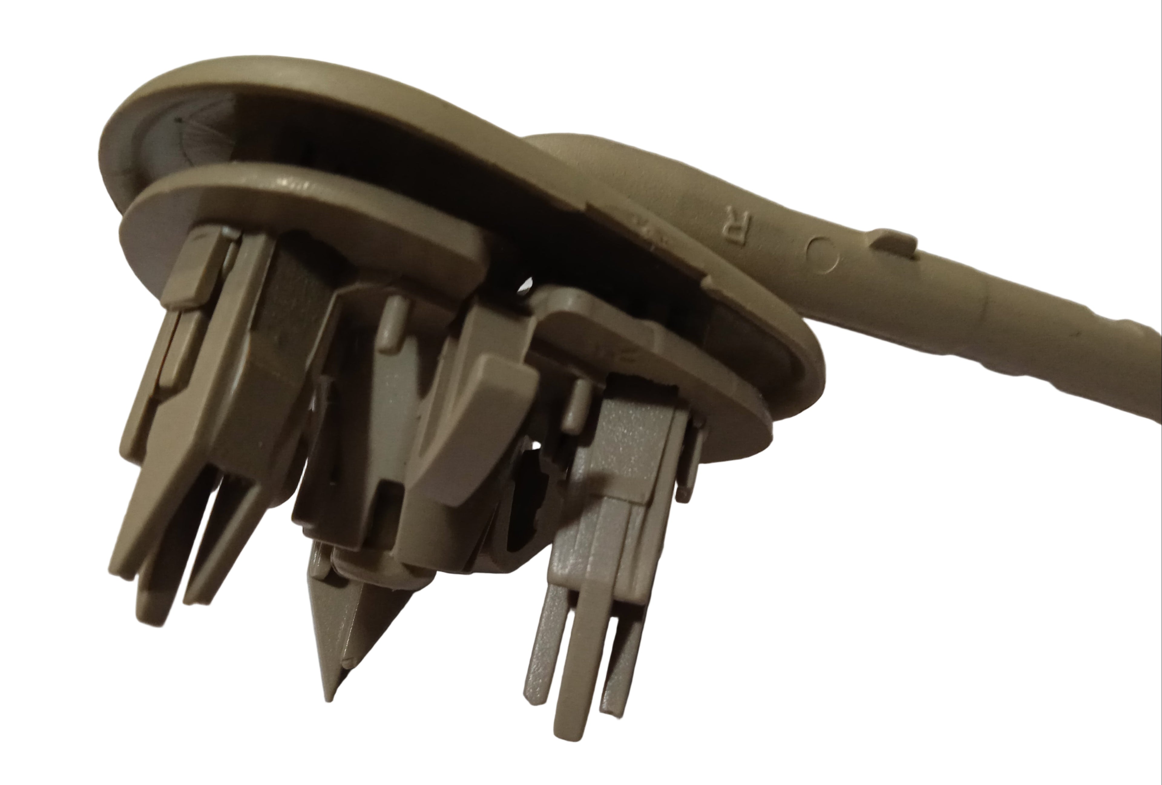 Brown plastic component with multiple attachments on a white surface