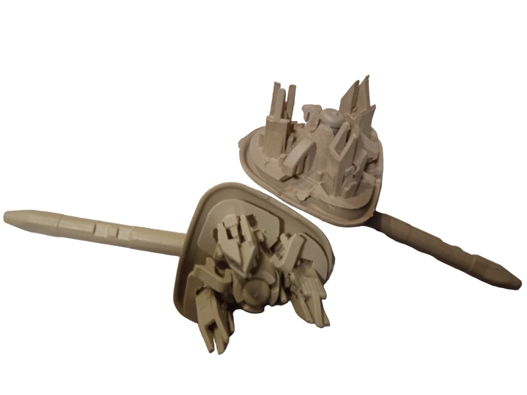 Toy model of a spaceship with detailed structures on a white surface