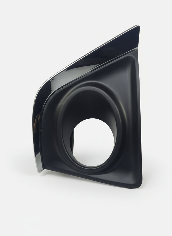 Black car part on a white surface