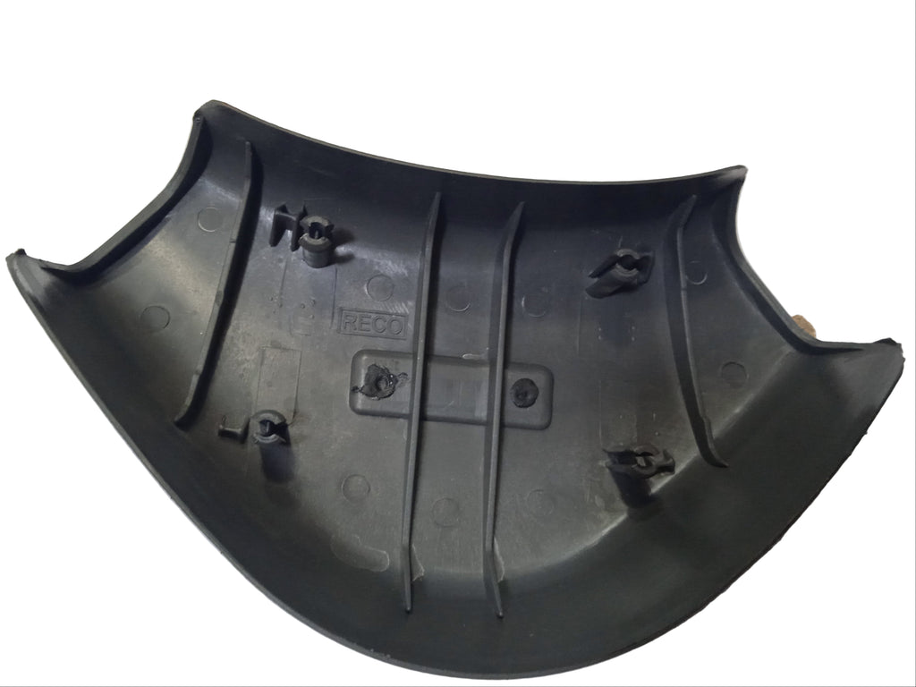 Black plastic car bumper on a white surface