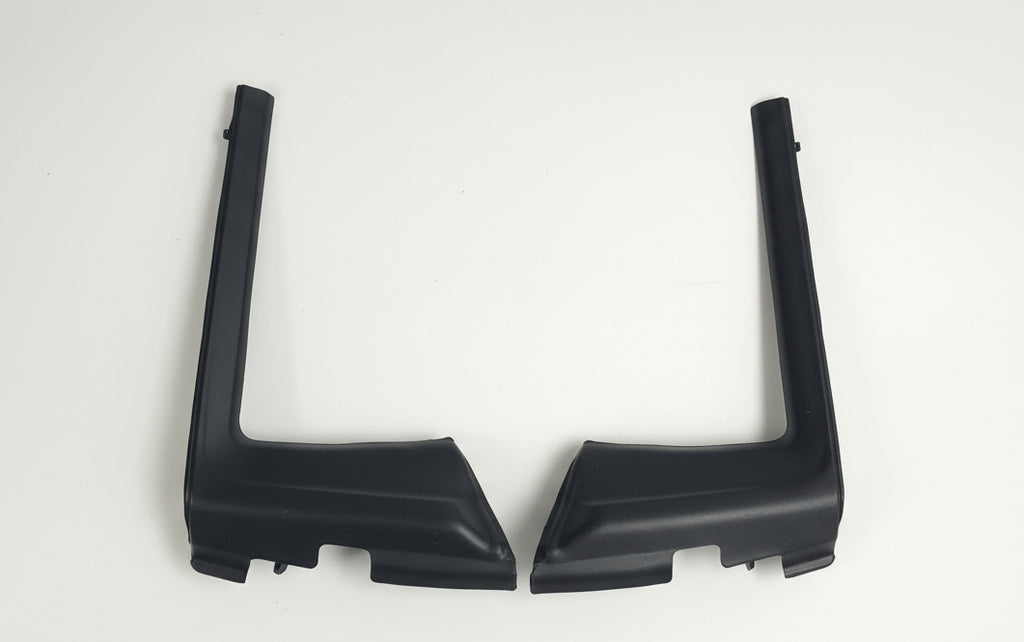 Two black plastic brackets on a white background