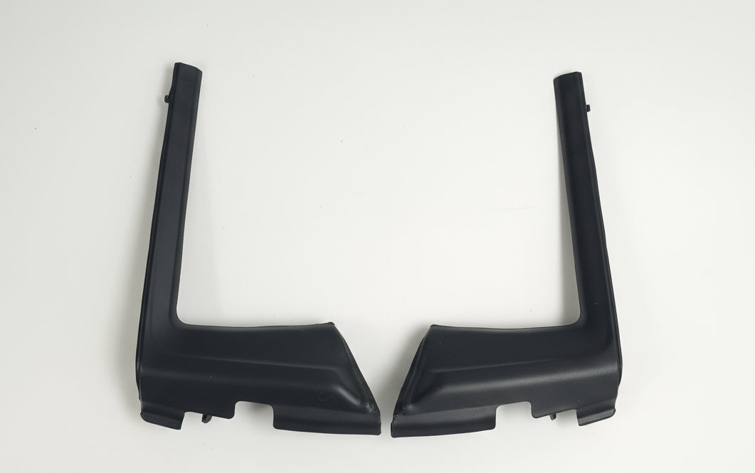 Two black plastic brackets on a white background