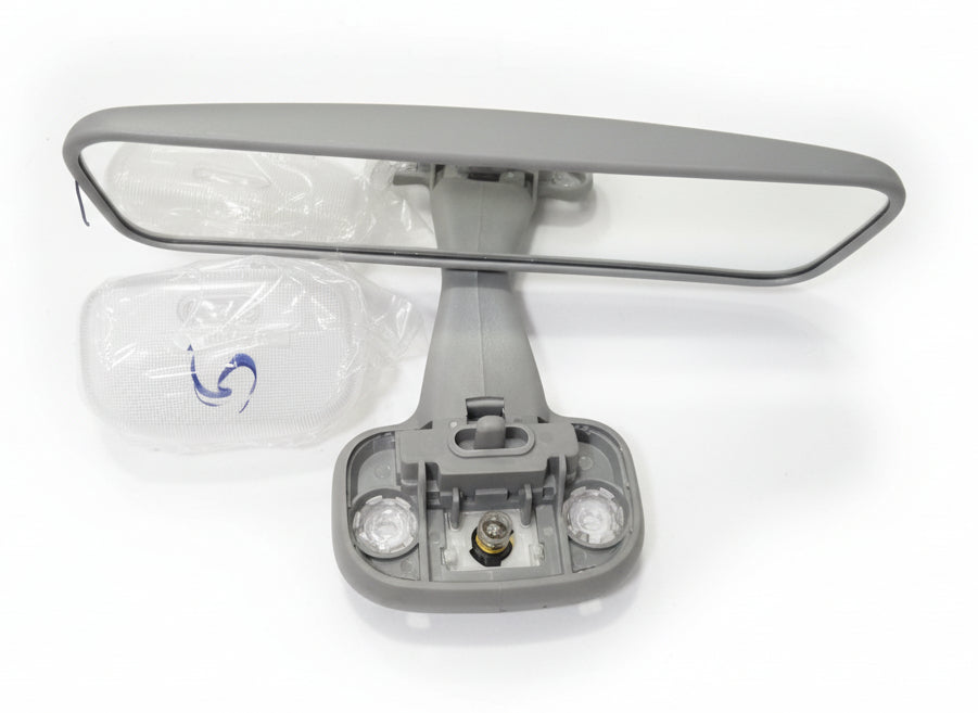 Car roof mirror with bulb on a white surface