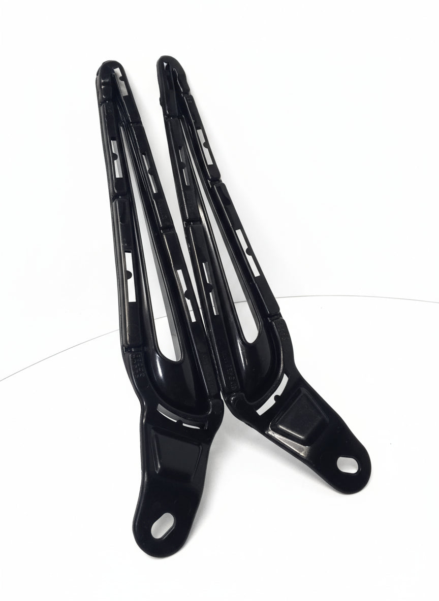 Black metal bracket on a white surface