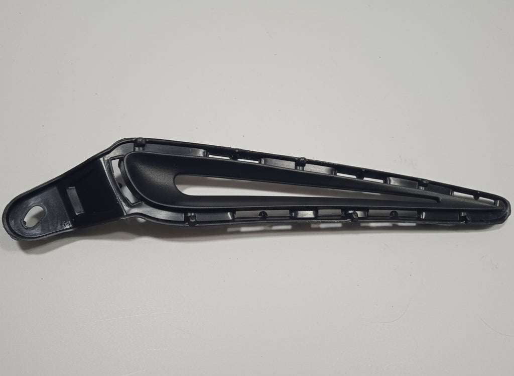 Black metal bracket on a white surface