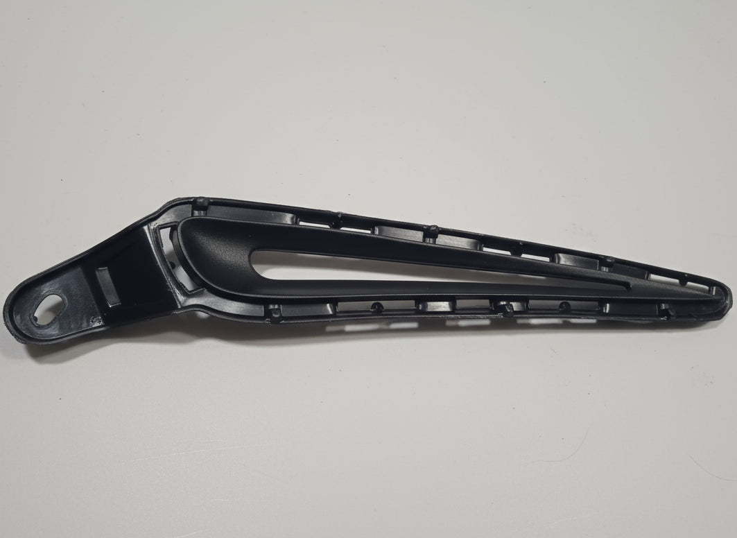 Black metal bracket on a white surface