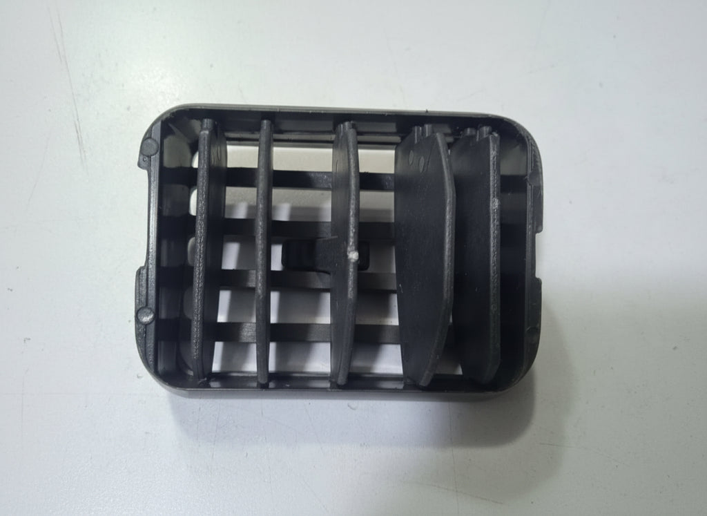 Black plastic component on a white background