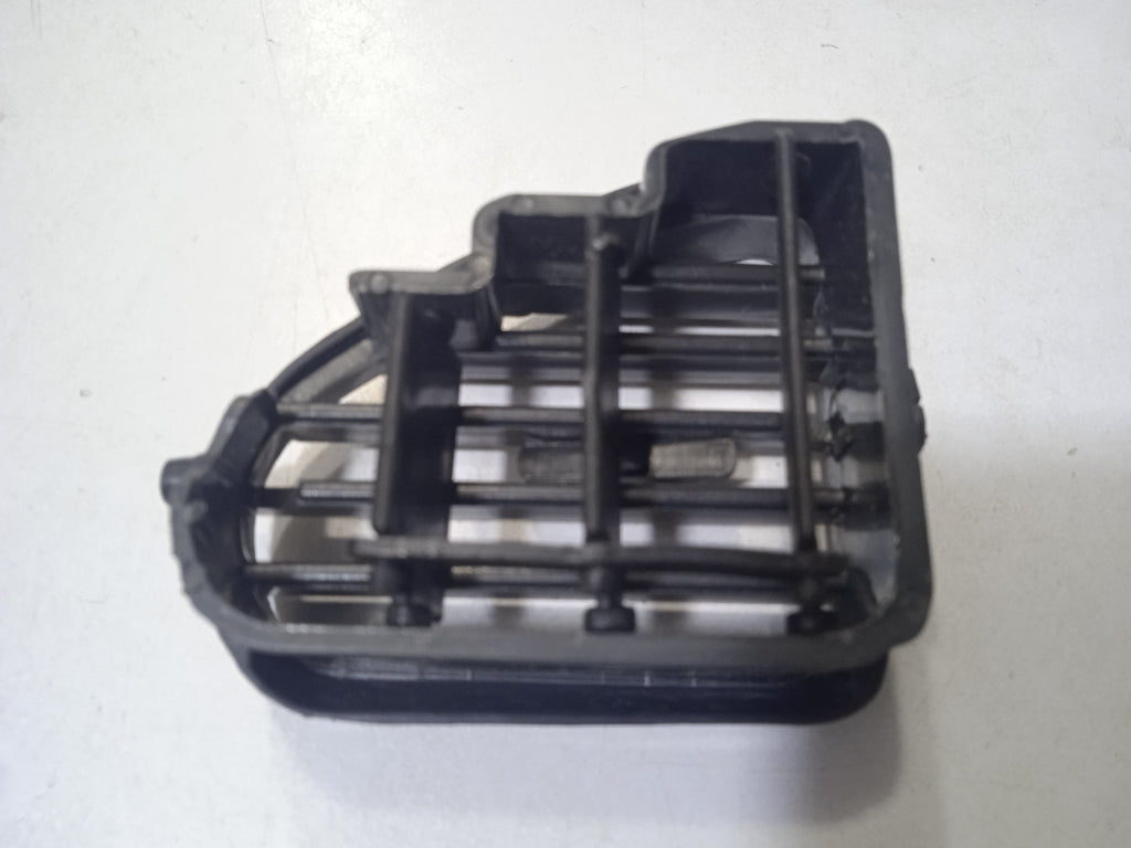 Black plastic component on a white background