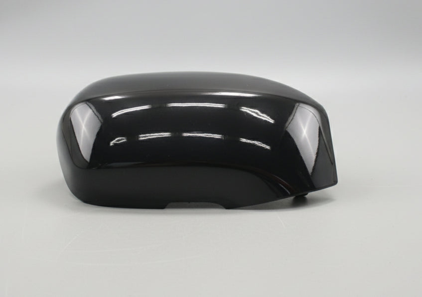 Black metallic object on a textured surface