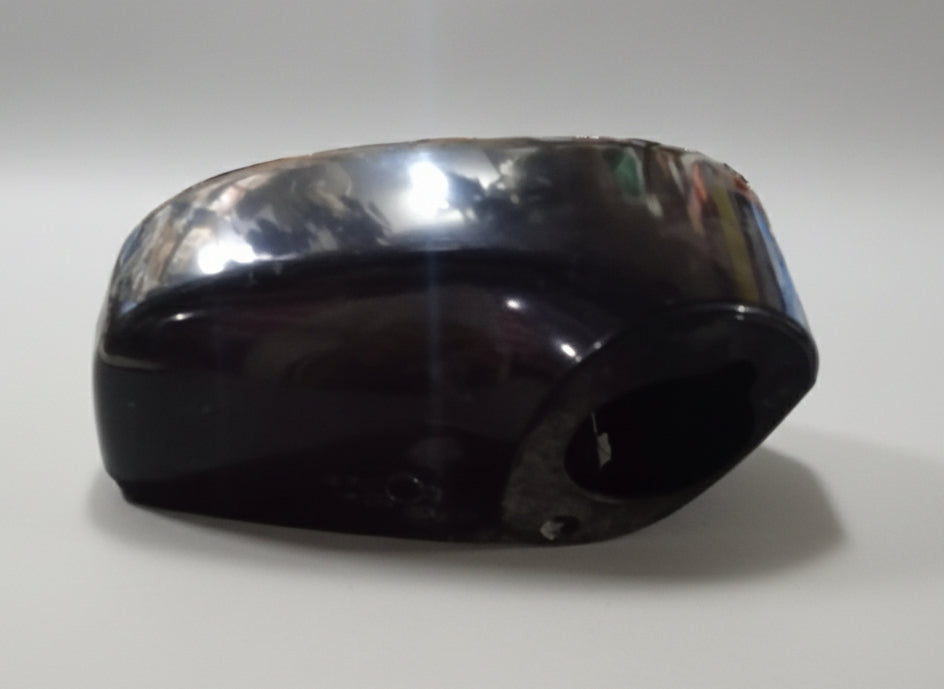 Black rubber gasket on a reflective surface with a blurred background