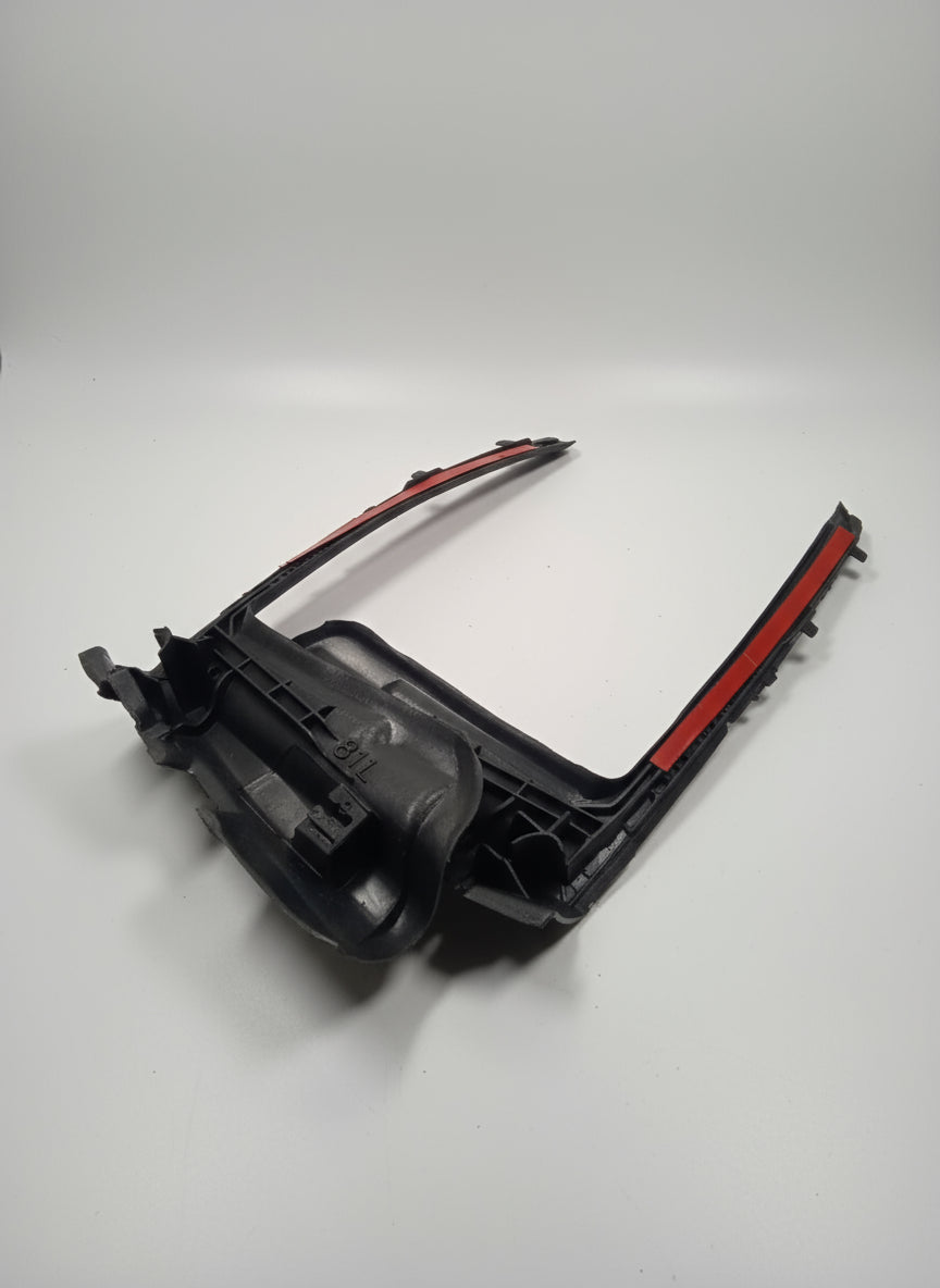 Car headlight housing on a white surface