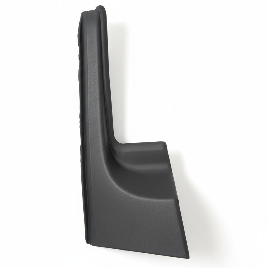 Black plastic car fender splash guard on a white surface