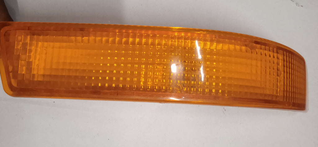Amber car marker light on a white background
