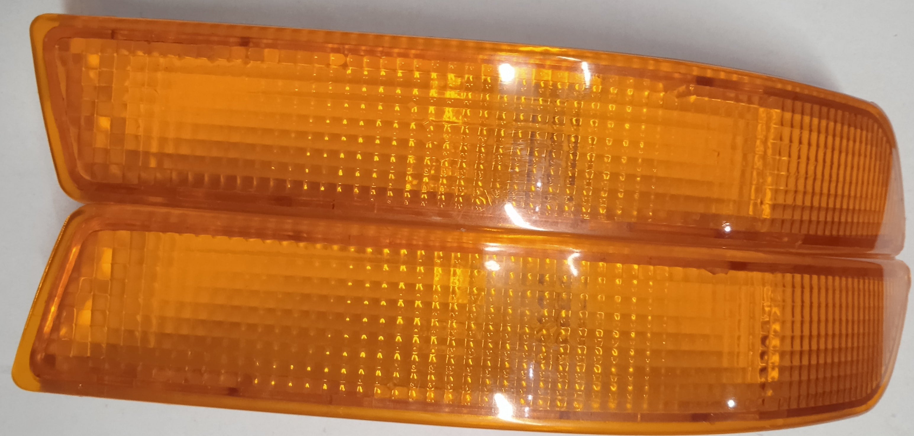 Two orange rectangular lenses on a white background