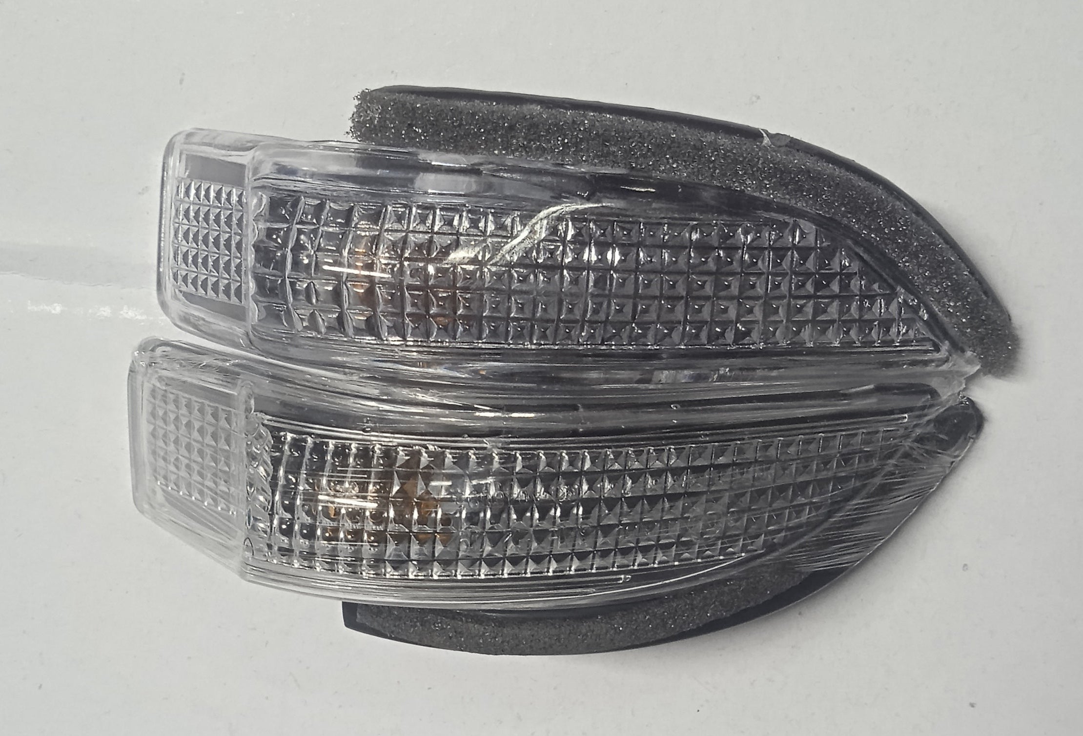 Pair of car side marker lights on a white background
