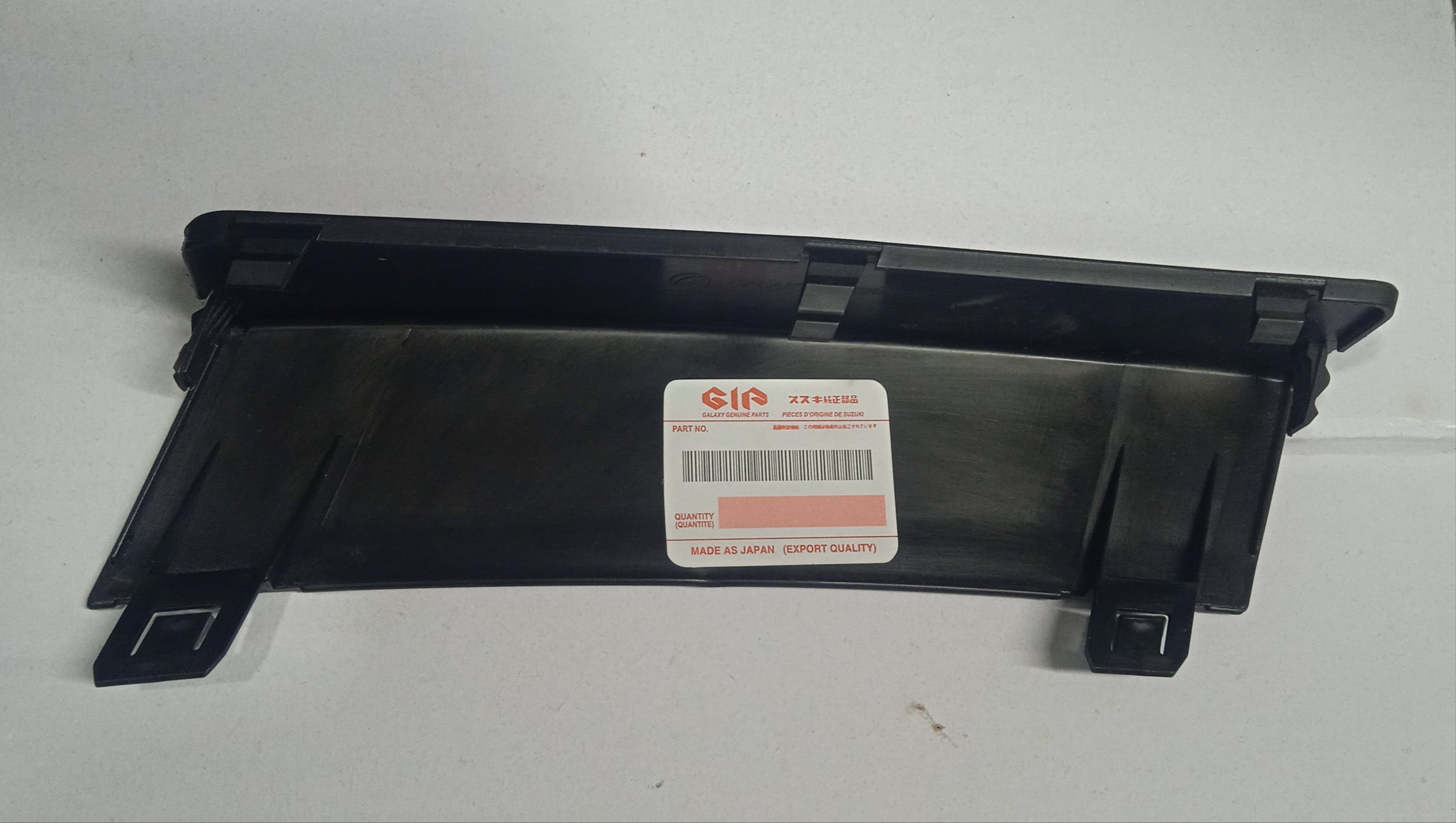 Black car part with a visible brand label on a white background