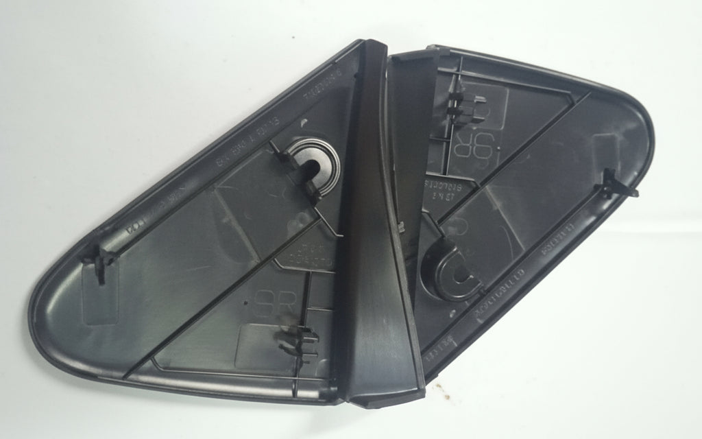 Black plastic mirror cover on a white background