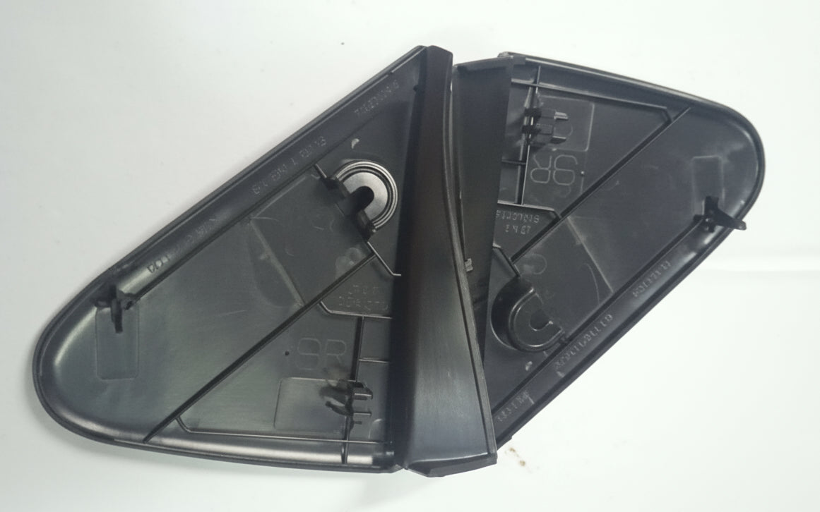 Black plastic mirror cover on a white background