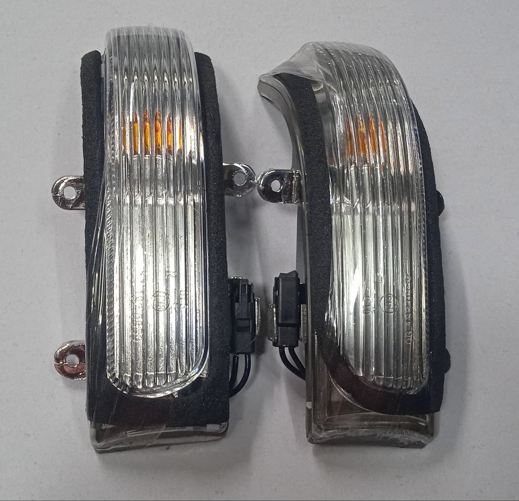 Two car fog lights on a white background