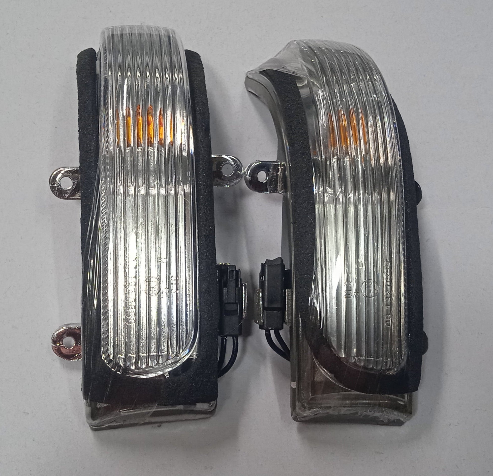 Two car fog lights on a white background