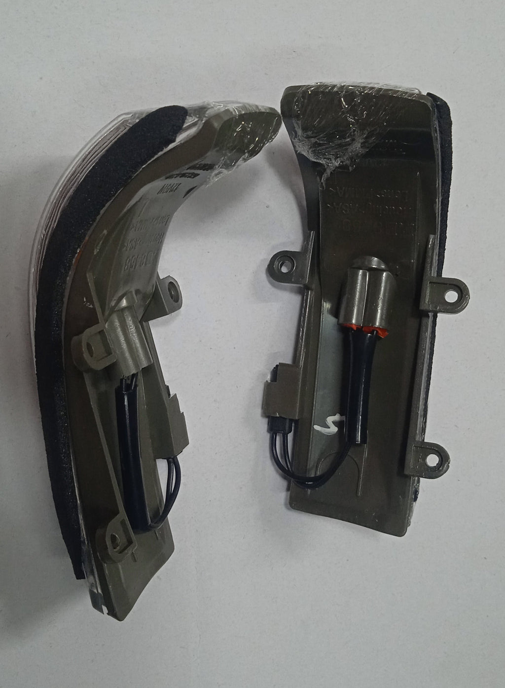 Two car side mirrors on a white background