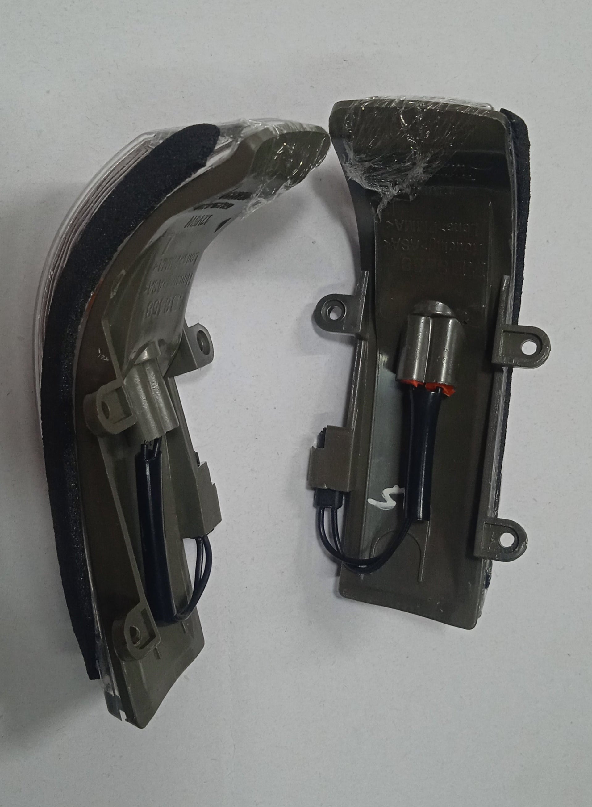 Two car side mirrors on a white background