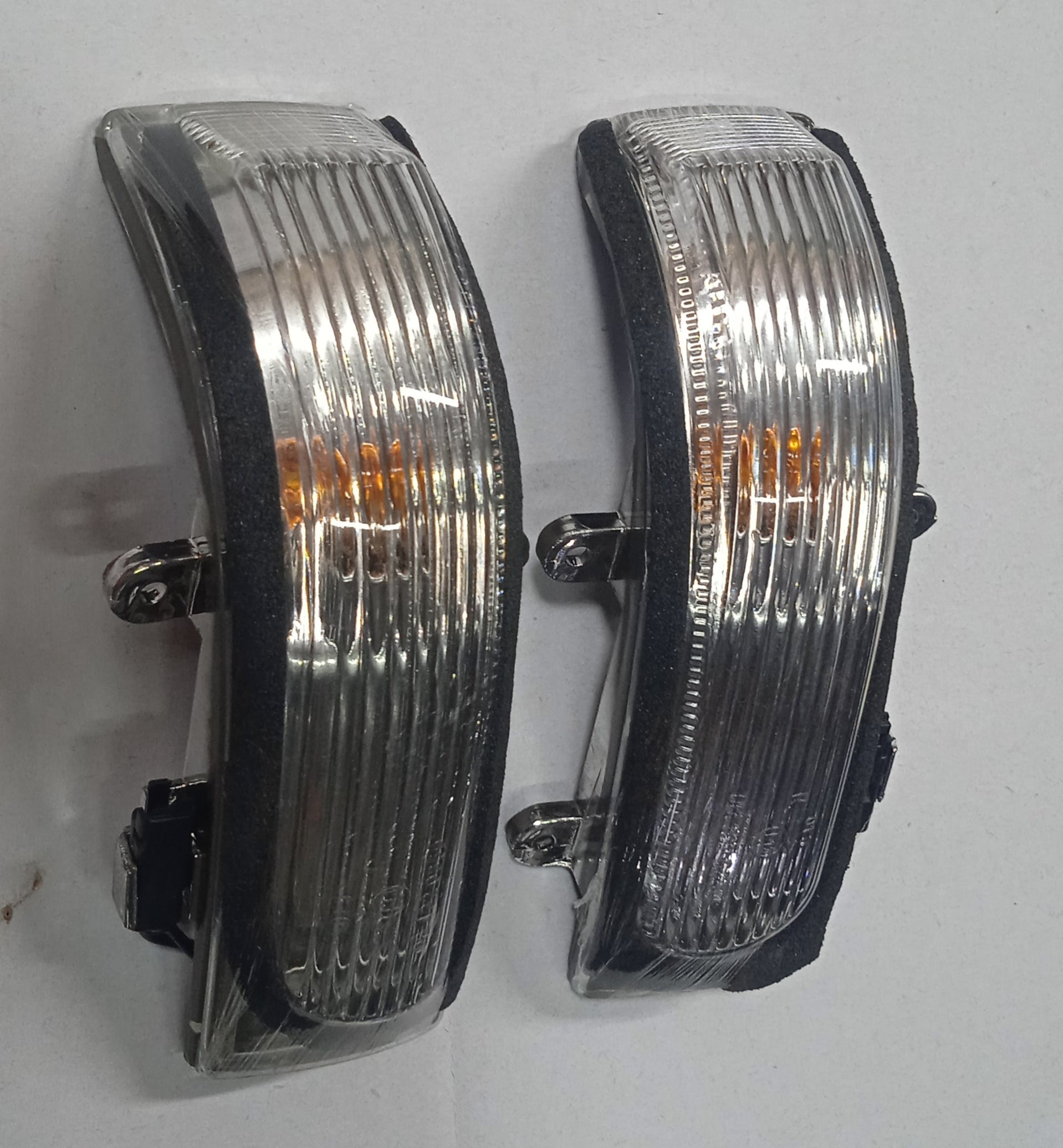 Pair of car headlights on a white background
