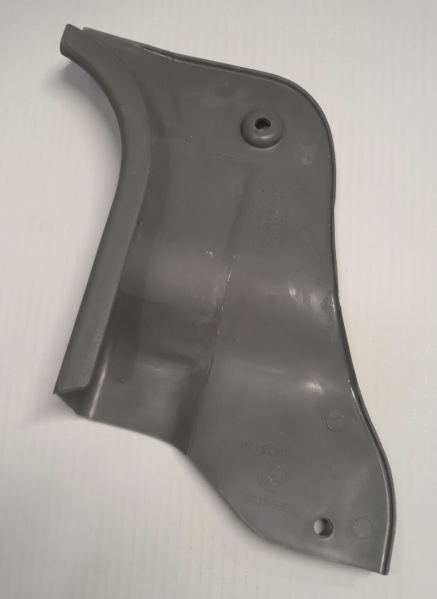 Black rubber boot on a tiled floor