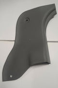Black plastic car panel on a white tiled background
