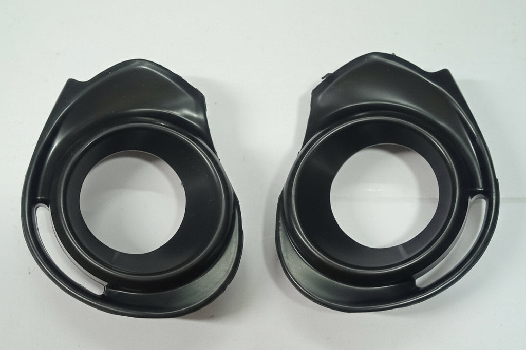 Two black plastic components on a white background