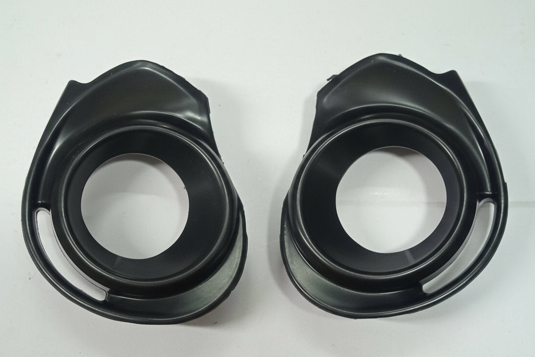 Two black plastic components on a white background