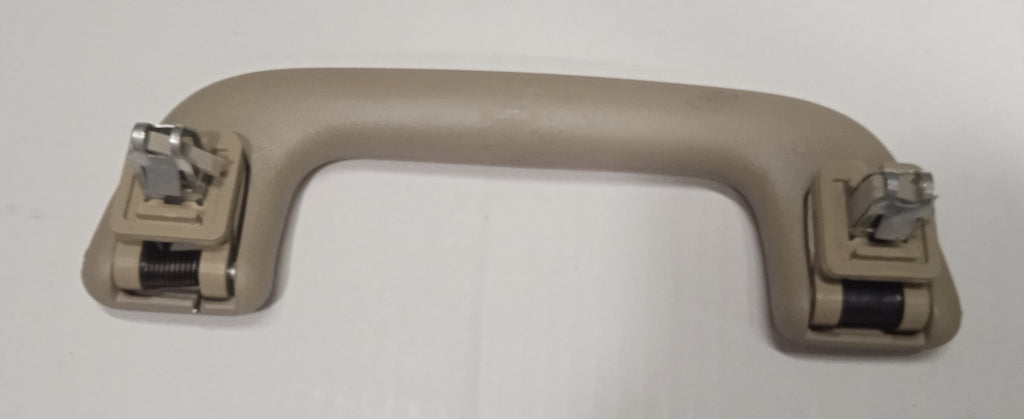 Beige car door handle on a white background